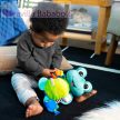 BABY EINSTEIN Aktív játék C-karikán teknős Neptune’s Sensory Sidekick™ 0hó+